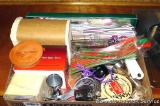 Box of bar stuff including straws, coasters, mixing measures, napkins, more.