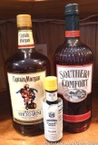 No shipping. 1.75 liter bottles of Captain Morgan and Southern Comfort, plus a bottle of bitters.
