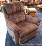Lane swiveling rocker recliner is in good condition and in neutral tones.