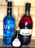No shipping. Huge bottle Korbel brandy; liter bottle of UV Blue raspberry flavored vodka; small gift