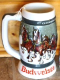Two Budweiser beer steins. One is 1985 A series, the other is 1983 Clydesdales 50th Anniversary.