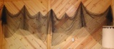 Two pieces of decorative fish netting. Measure approx. 10' as pictured across wall.
