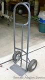 Pneumatic tire hand truck is over 4' tall.