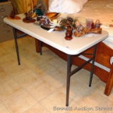 Resin 4' folding table is in good shape.
