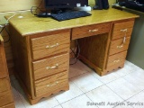 Nice seven drawer wooden desk is in very good condition. A few office supplies included, see photos.