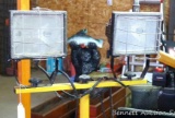 Tandem halogen work lights on telescoping stand, 4' tall as pictured. Knocks down and folds up for