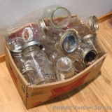 Assorted half pint, pint and quart canning jars.