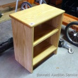 Sturdy little shelving unit with adjustable shelf is approx. 1-1/2' x 2' tall.