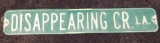 Decommissioned stamped steel road sign from Disappearing Creek Lane, 3' wide.