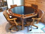 Folding game table with four rolling chairs. Very nice set up in great shape.