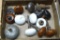 Assortment of door handle knobs, includes white porcelain, woodgrain and more.