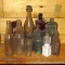 Collection of 19 bottles including vintage green, brown and white glass,