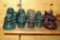 Brown ceramic, plus blue and clear glass insulators. Brown ceramic pieces are marked S B T.