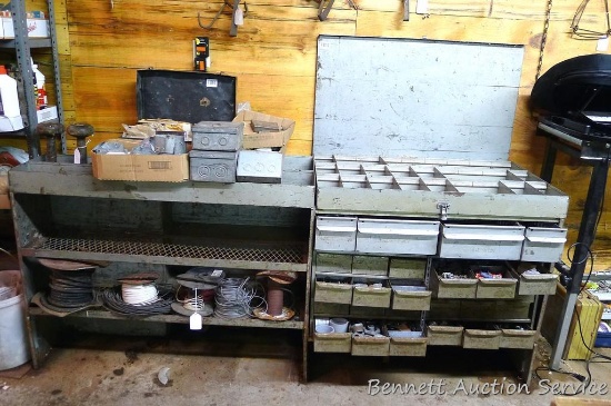 Metal storage cabinet with pull out drawers filled with mostly electrical supplies; lock nuts, wire