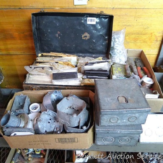 Assortment of electrical supplies including brown and ivory plates, galvanized boxes; wire staples