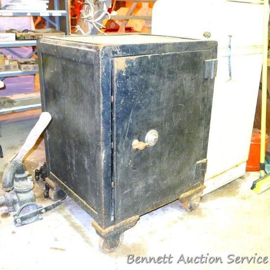 Antique combination safe with a Yale dial. Measures approx. 33" x 29" x 46" high. Top and bottom