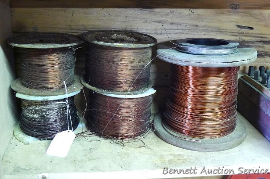 Partial roles of copper wire for rewinding electric motors, various sizes.