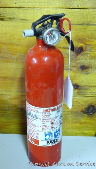 Kiddie dry chemical BC fire extinguisher. No mounting bracket. Gauge shows charged. 14" tall.