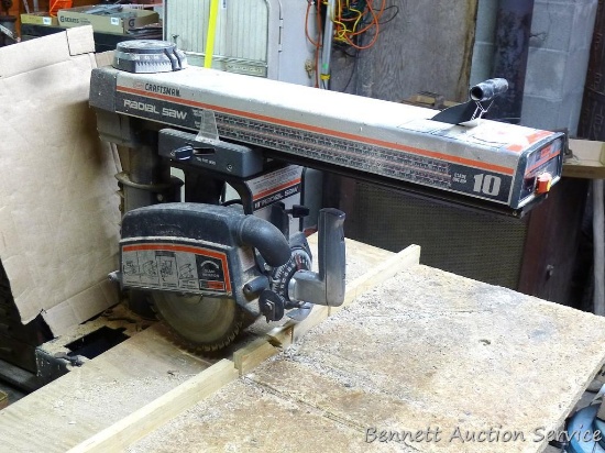 Craftsman 10" radial arm saw. Mounted on nice metal bench. All in nice shape. Works.