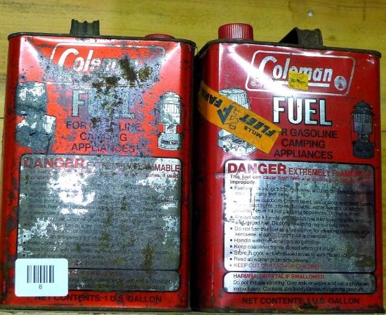 Two Coleman fuel one gallon cans for gasoline camping appliances full of fuel. No shipping.