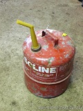 Gas can 5-1/4 gallon has dents and surface rust.