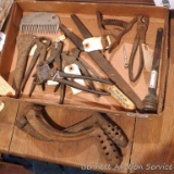 Box of curiosities including hog ring pliers, shaker grate handles, alligator wrench, waste pipe