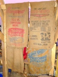 Four old burlap feed sacks, each approx. 2'x3'.