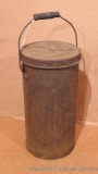 Metal canister with carrying handle. Stands 17