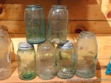 Collection of 6 green glass jars including Mason, Ball and Boyd. Tree metal screw-on tops included.