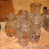 Cream bottles including Sanida Kilbourn and Weaver.