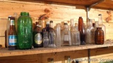 Old beer and other bottles including Hamm's, Stroh's, plus a bunch of other bottles. Tallest is