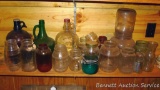 Glass collection including jugs and various other jars.