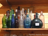 Brown, blue, green, pink and a few clear old glass bottles up to approx. 13