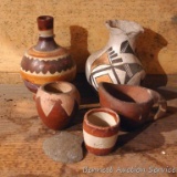 Little painted clay vases, bowl and pitcher. Also stone 'broadhead' shaped piece. Vases are approx.