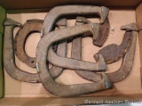 Four throwing horse shoes, two ox shoes and a ring horse shoe.