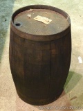 Nice wooden keg is dark toned and is nearly two feet tall. Feels solid. Missing one band.