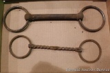 Two antique horse bits; one twisted iron and one is cast iron. Longest is 13-1/2.