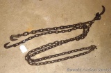 Vintage 3/8 logging chain. 14' long and has grab hooks on both ends and has a log hook middle.