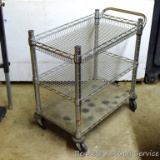 Metal rolling cart with three shelves. Measures 33