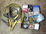 Set pf automotive jumper cables, oil filter wrenches, and more.