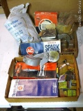 Assortment of spark plugs, includes ACR 46N, Champion RF11YC, Auto fuses. Tractor exhaust flapper.