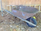 Metal wheel barrow that could be made into a flower planter. The tub already has a drain hole 5' x