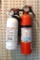 No shipping.  Two Kidde fire extinguishers with mounting brackets. Gauges show charged.