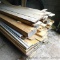 Pile of planed hardwood including maple, oak, possibly other; plus a few pieces of softwood and