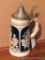 1/2 liter stoneware stein with lid is marked 'Germany' on the bottom. Stands 8-3/4