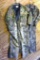 Two pair of camo coveralls. Winchester suit is size XL. Other is 2XL Tall. Both are in good