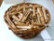 Basket full of heavy duty wooden clothes pins. Basket measures 9