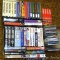 VHS tapes, plus some music CDs. Video titles include Forrest Gump, Titanic, Johnny Carson, Johnny