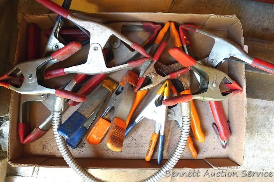 Collection of metal clamps with protected ends, largest is approx 9"x 7".