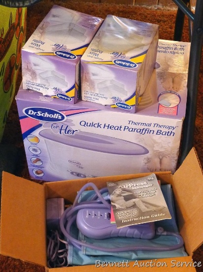 Dr. Scholl's quick heat paraffin bath with two wax refills; AirPress massager appears new in box.